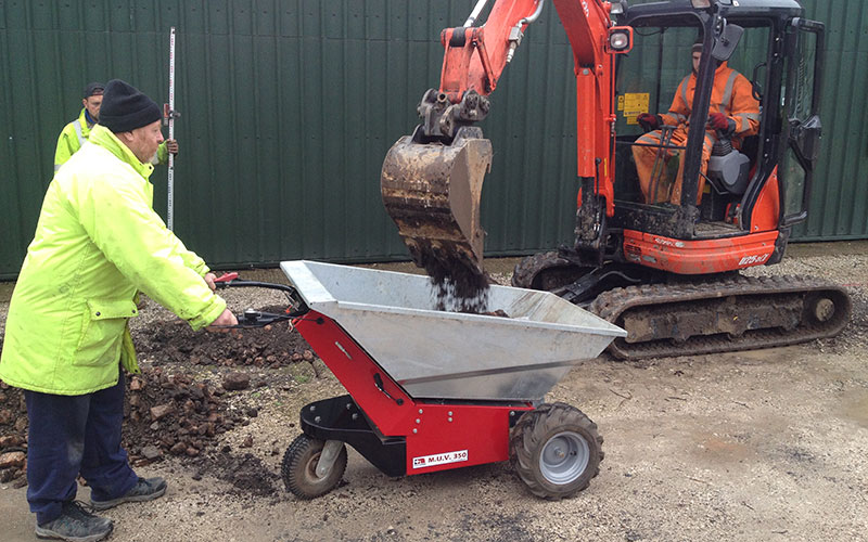 MUV - Electric powered Wheelbarrow being loaded by mini-digger