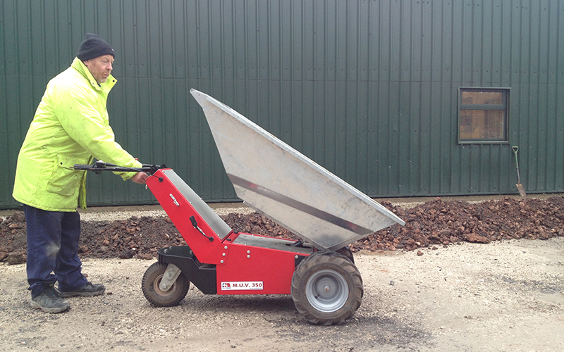 Electric Wheelbarrow with galvanised steel tub to show electric tip operation