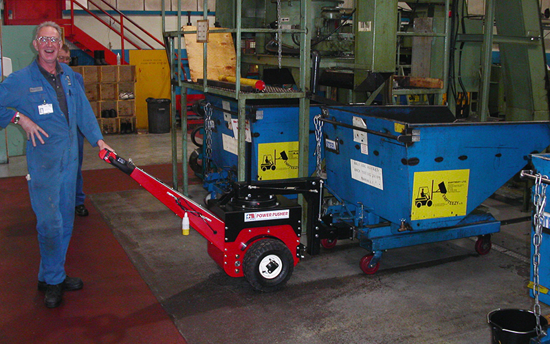 Power Pusher, with Steering Arm, moving Empteezy tipping skip in machine shop