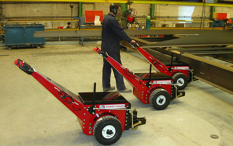 Power Pusher, with bespoke attachments, pushing large steel fabrications along a rail-based production line