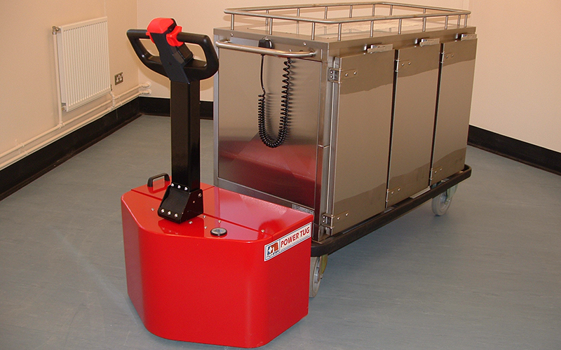PowerTug moving 1,000Kg Corsair heated food trolley in prison kitchen