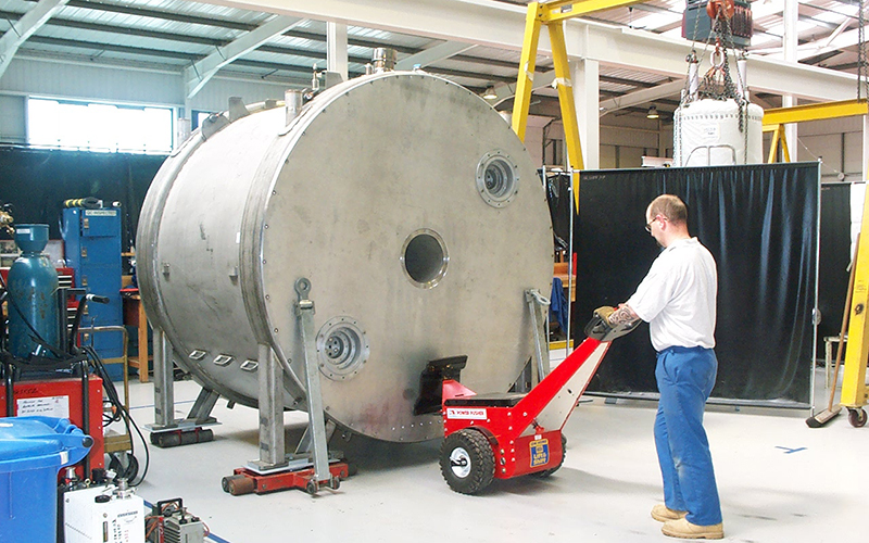 Power Pusher pushing large MRI magnet mounted on skates for MRI Scanner manufacturer