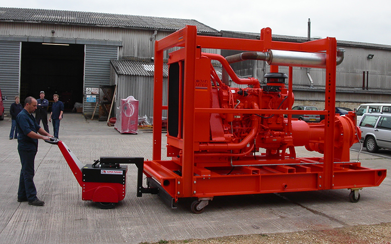Super Power Pusher, with Steering Arm, moving 8,000Kg industrial pump on skid for Xylem Pumps
