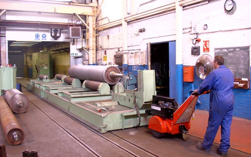 Super Power Pusher moving 55,000Kg roll handling bogie in and out of shot blasting booth