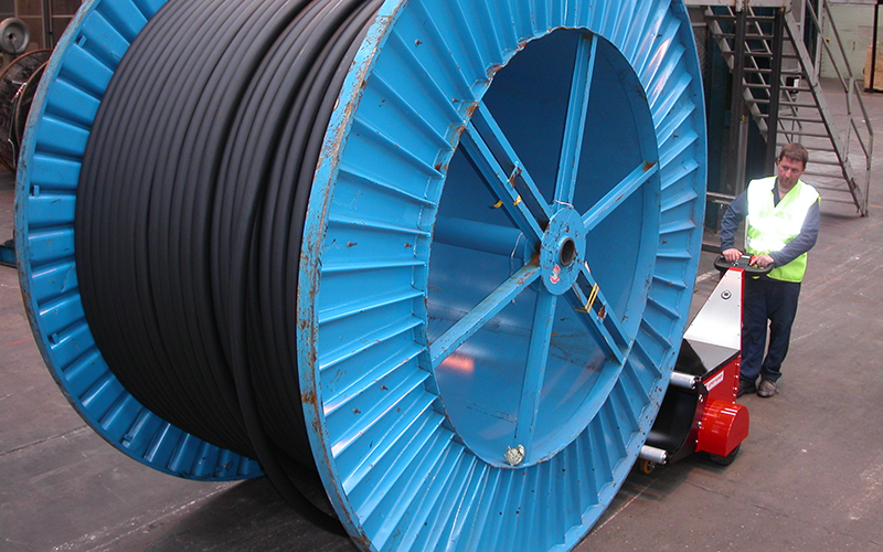 Super Power Pusher, with Roller Attachment, pushing 20,000Kg cable drum at Prysmian Cable
